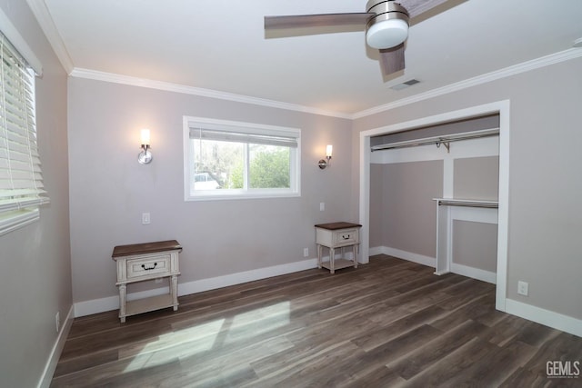 unfurnished bedroom with ceiling fan, dark hardwood / wood-style floors, ornamental molding, and a closet