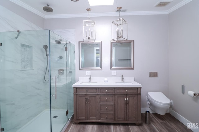 bathroom with crown molding, a shower with door, vanity, and hardwood / wood-style floors