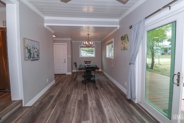 dining room featuring crown molding, dark wood-type flooring, and a notable chandelier