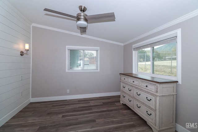 unfurnished bedroom with ceiling fan, dark hardwood / wood-style floors, lofted ceiling, and ornamental molding