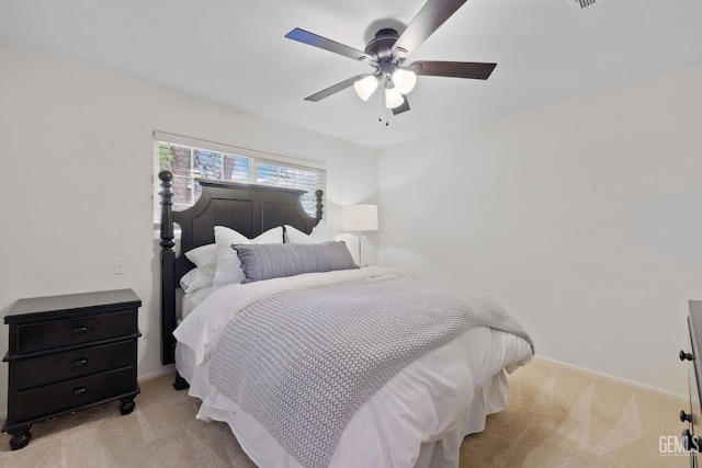 bedroom with light carpet and ceiling fan