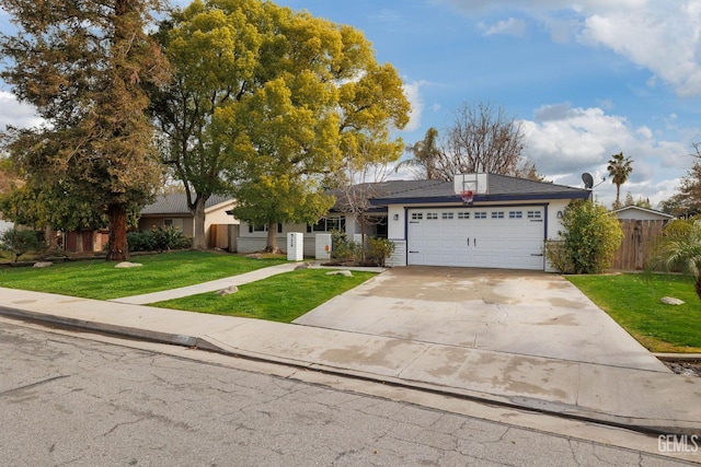 view of front of house with a garage and a front yard