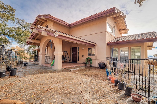 back of house with a patio area