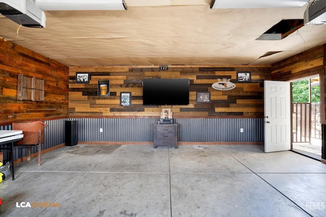 13271 Garzoli Ave, Mc Farland, CA 93250 - garage featuring wood walls and a garage door opener