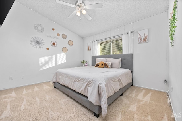 carpeted bedroom with lofted ceiling, ceiling fan, and a textured ceiling