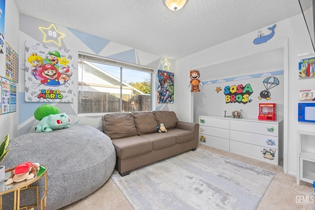 carpeted living room featuring a textured ceiling