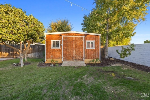 view of outdoor structure featuring a yard