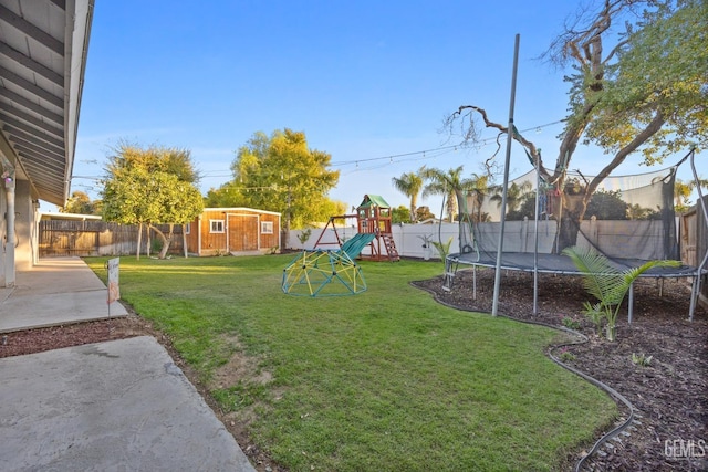 view of yard with a playground, a storage unit, a trampoline, and a patio