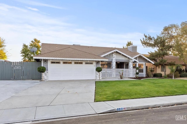 ranch-style house featuring a garage and a front lawn