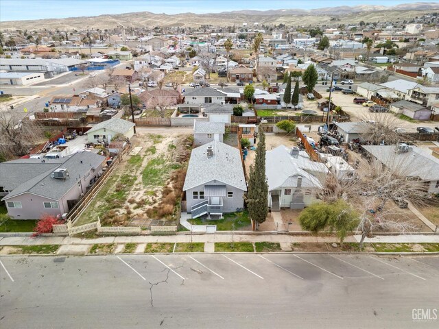 bird's eye view featuring a mountain view and a residential view