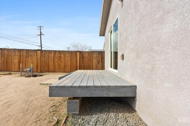 view of yard featuring a deck and fence
