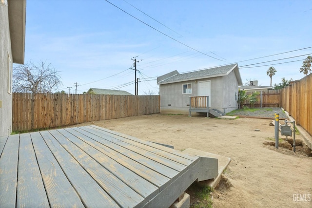 deck with a fenced backyard