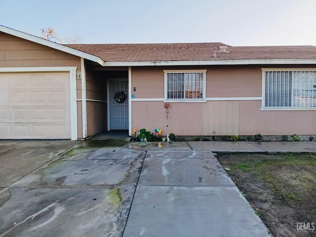 doorway to property featuring a garage