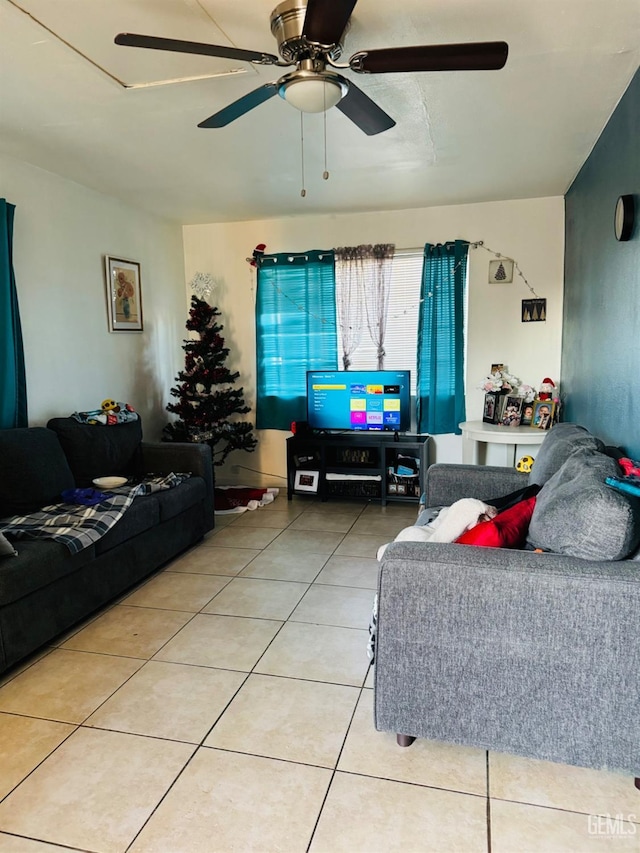 tiled living room with ceiling fan