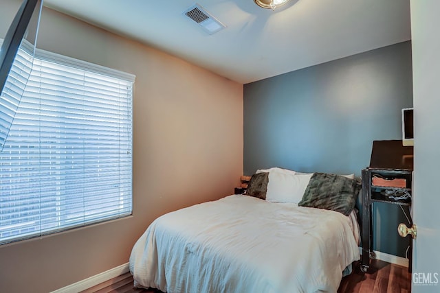 bedroom featuring hardwood / wood-style flooring