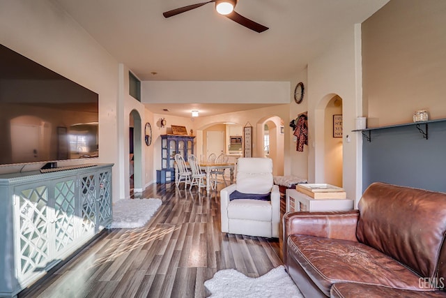 living room featuring hardwood / wood-style flooring and ceiling fan