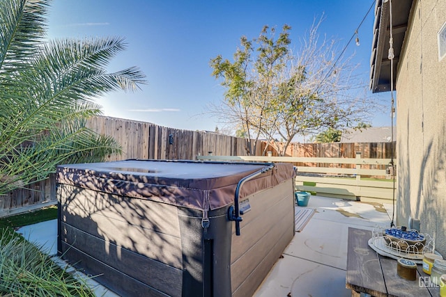 exterior space with a hot tub