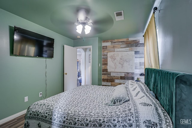 bedroom featuring hardwood / wood-style flooring and ceiling fan