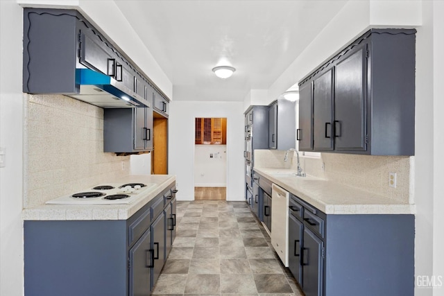 kitchen with decorative backsplash, sink, exhaust hood, and white appliances