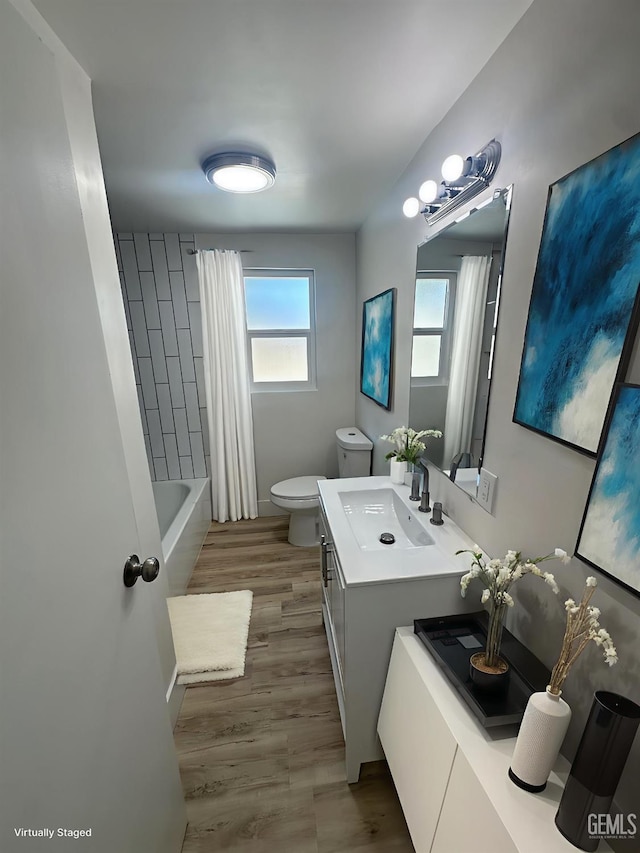 3417 River Blvd, Bakersfield, CA 93305 - full bath with vanity, shower / tub combo with curtain, and wood finished floors
