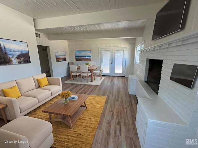 3417 River Blvd, Bakersfield, CA 93305 - living room featuring wood finished floors, a wood ceiling with exposed beams, french doors, and a brick fireplace