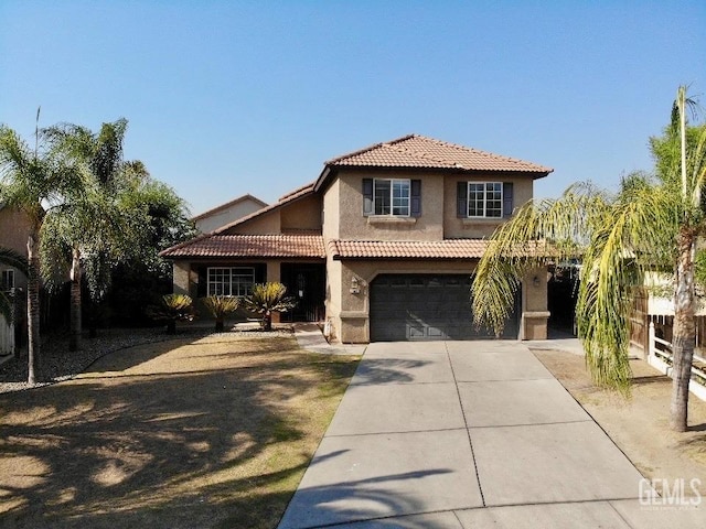 mediterranean / spanish house featuring stucco siding, a garage, concrete driveway, and a tiled roof