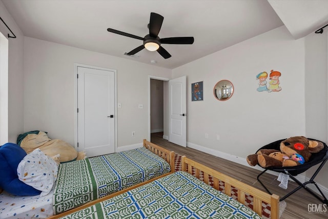 7544 Clifford Ct, Bakersfield, CA 93313 - bedroom with wood finished floors, baseboards, and ceiling fan