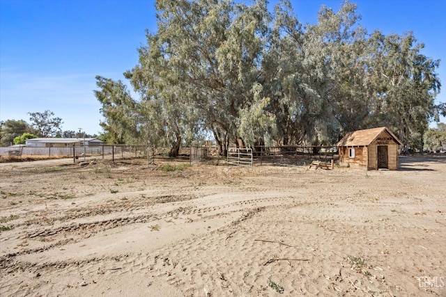 7544 Clifford Ct, Bakersfield, CA 93313 - view of yard with an outdoor structure and a view of countryside