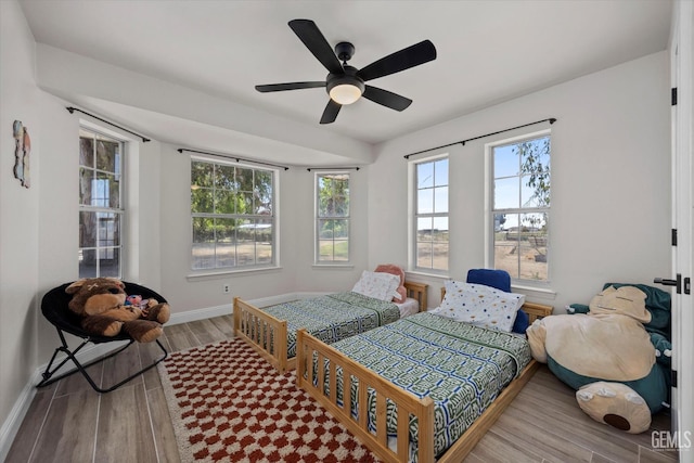 7544 Clifford Ct, Bakersfield, CA 93313 - bedroom with wood finished floors, baseboards, and a ceiling fan