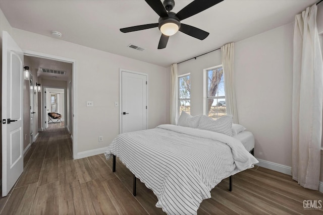 7544 Clifford Ct, Bakersfield, CA 93313 - bedroom with baseboards, wood finished floors, and ceiling fan