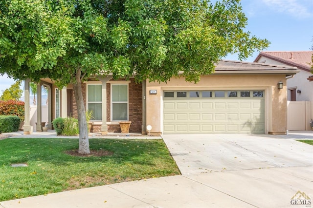 6107 Saint John Pl, Bakersfield, CA 93306 - view of property hidden behind natural elements featuring a garage, driveway, stucco siding, and a front yard