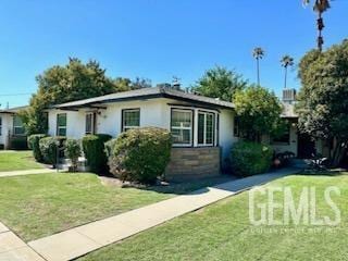 3100 18th St, Bakersfield, CA 93301 - exterior space featuring stucco siding and a front lawn