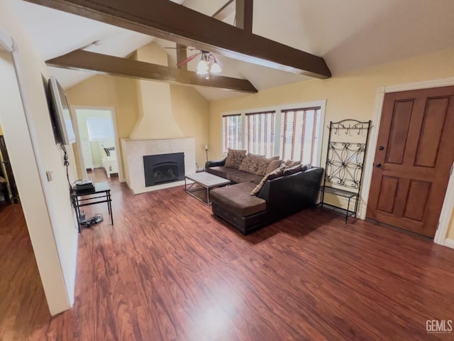 living room featuring lofted ceiling with beams and dark wood-type flooring