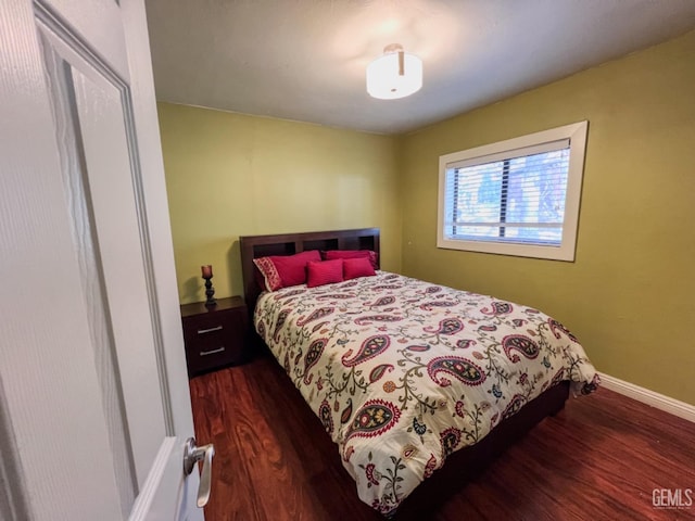 bedroom featuring dark hardwood / wood-style flooring