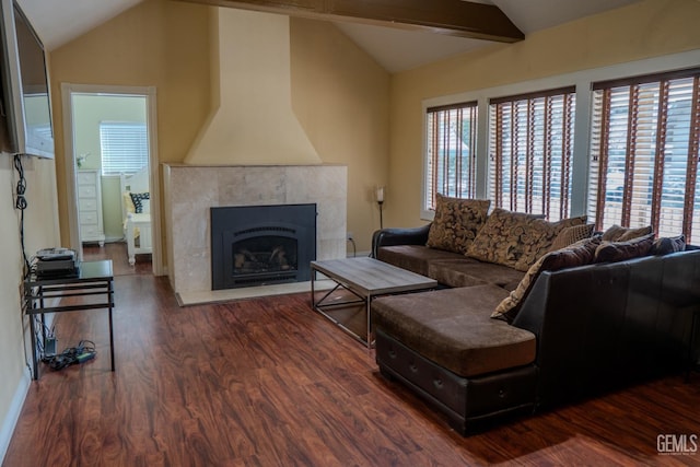 living room with lofted ceiling with beams and dark wood-type flooring