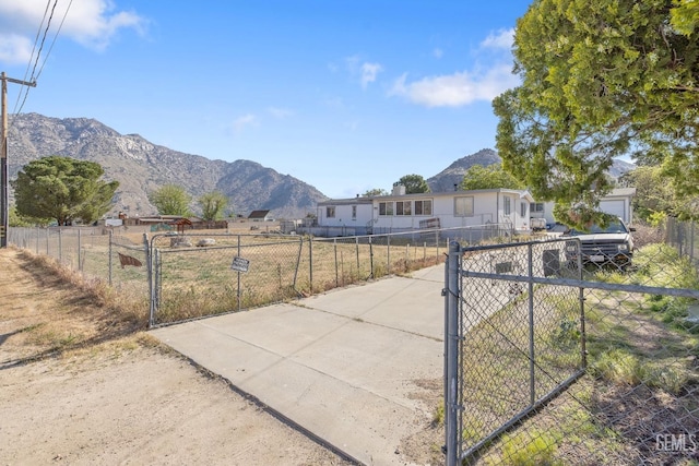 7958 Harmony Ln, Onyx, CA 93255 - view of community with a gate, a mountain view, and fence
