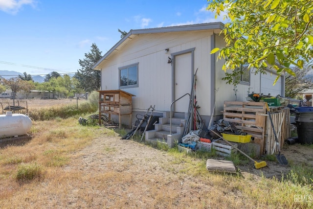 7958 Harmony Ln, Onyx, CA 93255 - rear view of house featuring entry steps and fence