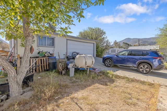 7958 Harmony Ln, Onyx, CA 93255 - garage featuring a mountain view and driveway