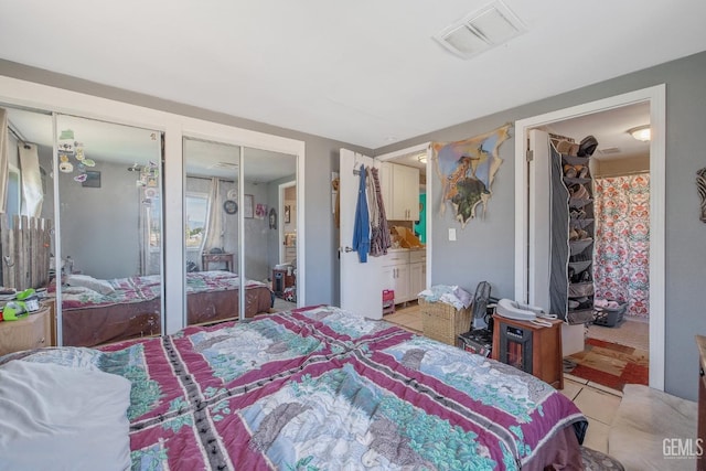 7958 Harmony Ln, Onyx, CA 93255 - bedroom with light tile patterned floors and multiple closets