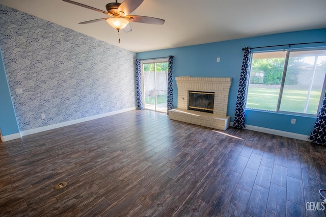 5514 Lombardy Ct, Bakersfield, CA 93308 - unfurnished living room with wallpapered walls, a ceiling fan, baseboards, an accent wall, and dark wood-type flooring