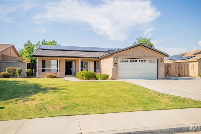 5514 Lombardy Ct, Bakersfield, CA 93308 - ranch-style home with a porch, an attached garage, concrete driveway, and solar panels