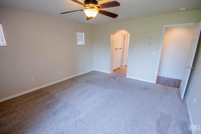 5514 Lombardy Ct, Bakersfield, CA 93308 - unfurnished bedroom with arched walkways, carpet, baseboards, and ceiling fan