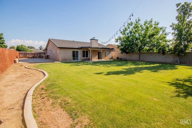 5514 Lombardy Ct, Bakersfield, CA 93308 - rear view of property with a chimney and a patio