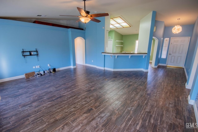 5514 Lombardy Ct, Bakersfield, CA 93308 - unfurnished living room featuring arched walkways, lofted ceiling, dark wood finished floors, a ceiling fan, and baseboards