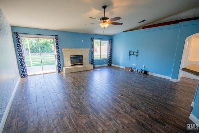 5514 Lombardy Ct, Bakersfield, CA 93308 - unfurnished living room with ceiling fan, lofted ceiling, dark wood finished floors, arched walkways, and a brick fireplace
