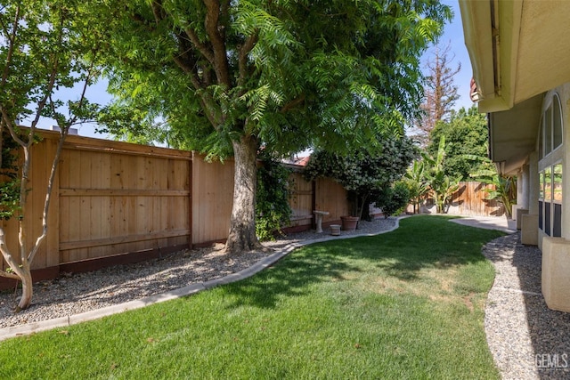 view of yard with a fenced backyard