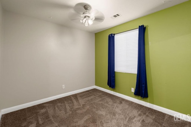 unfurnished room with ceiling fan and carpet floors