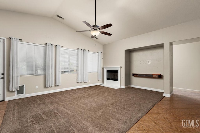 unfurnished living room with tile patterned flooring, ceiling fan, and lofted ceiling