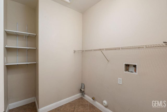 laundry area featuring tile patterned flooring, hookup for a gas dryer, and hookup for a washing machine