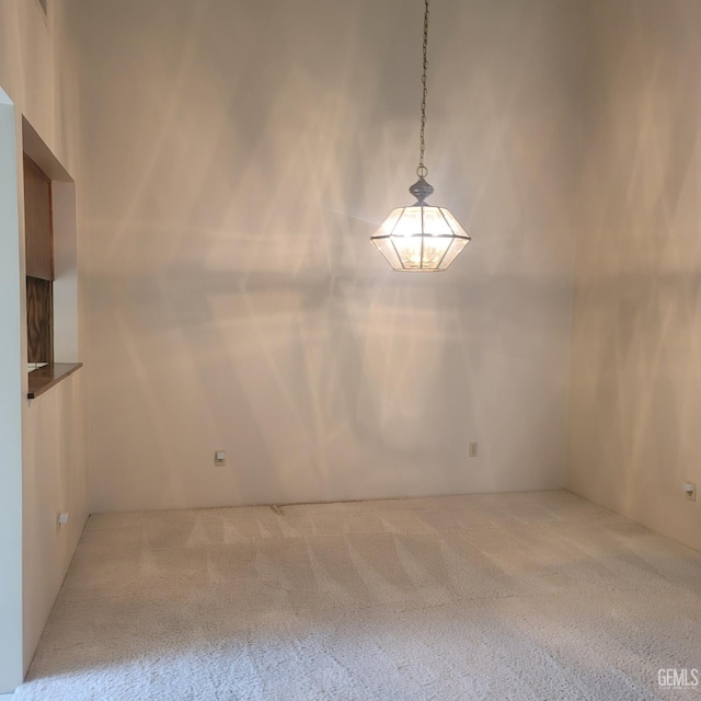 unfurnished room featuring carpet flooring